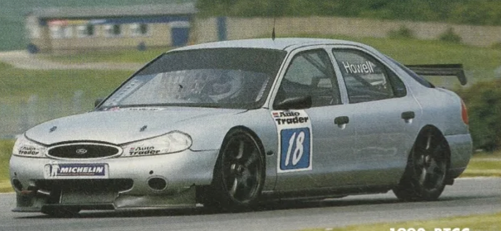 Silver Howell race car on circuit
